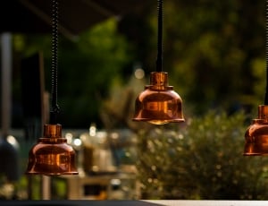 close up photography of three hanging lamps thumbnail
