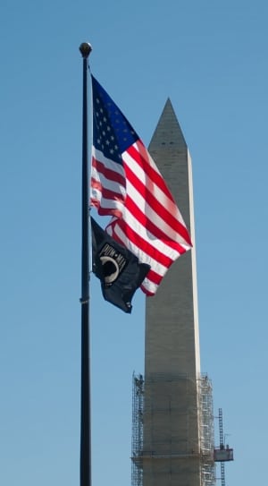 us flag near concrete building thumbnail