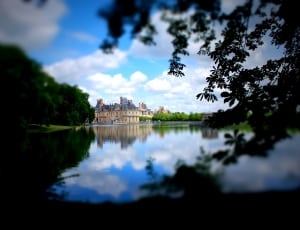 selective photography of castle near body of water thumbnail