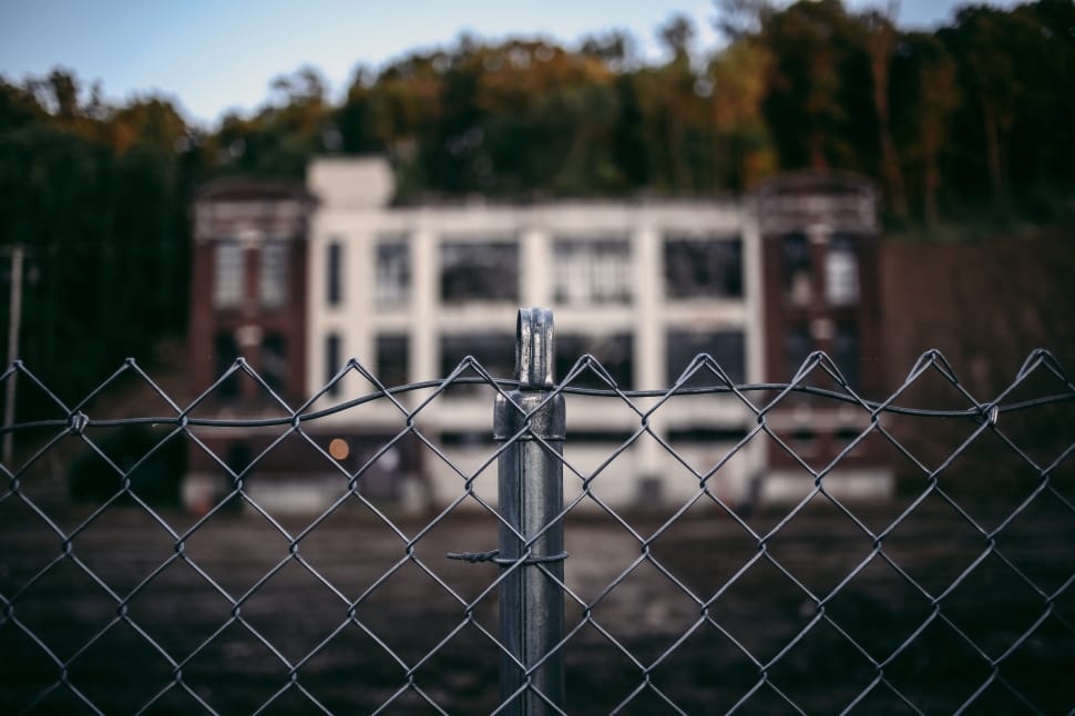 tilf shift lens photography of gray metal cyclone fence preview
