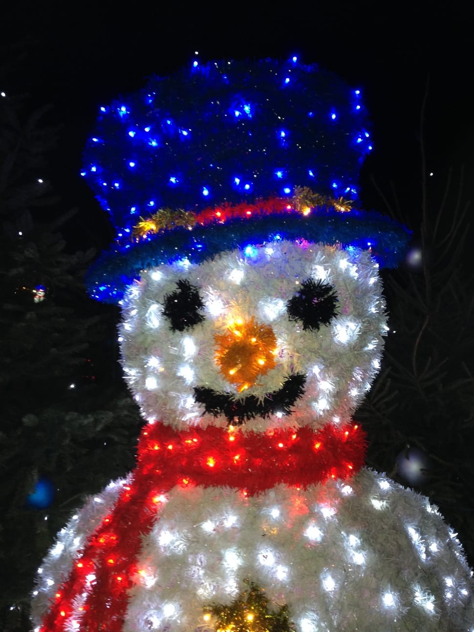 white blue and red snowman with scarf and hat statue preview