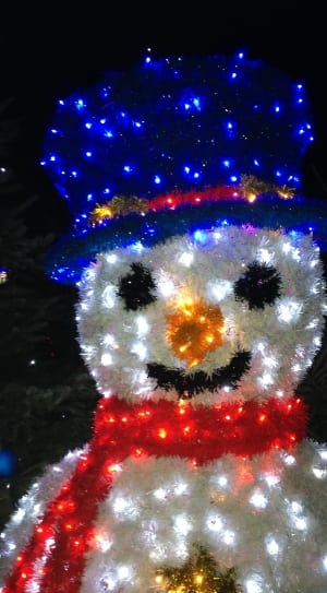 white blue and red snowman with scarf and hat statue thumbnail