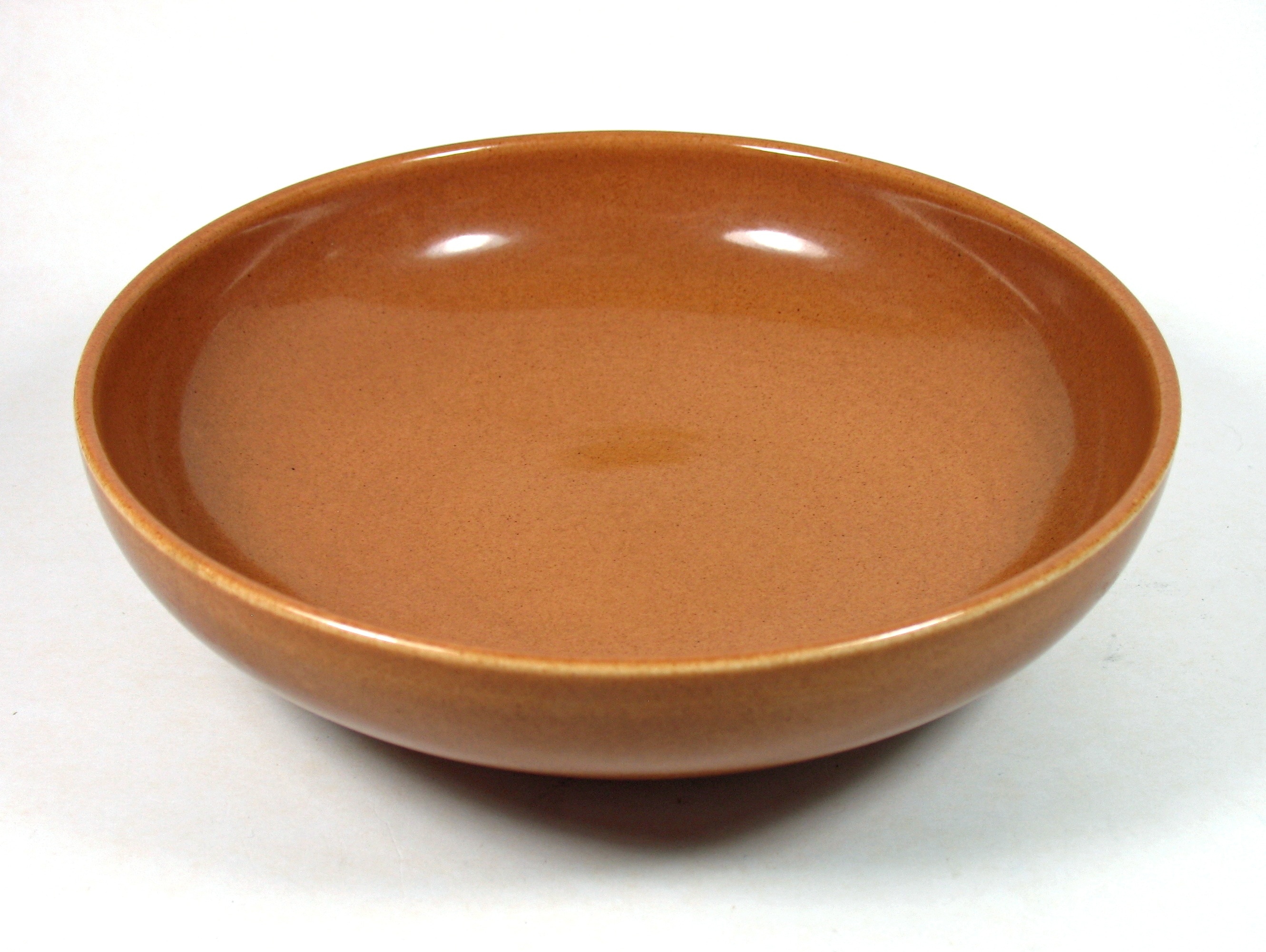 brown ceramic round dish