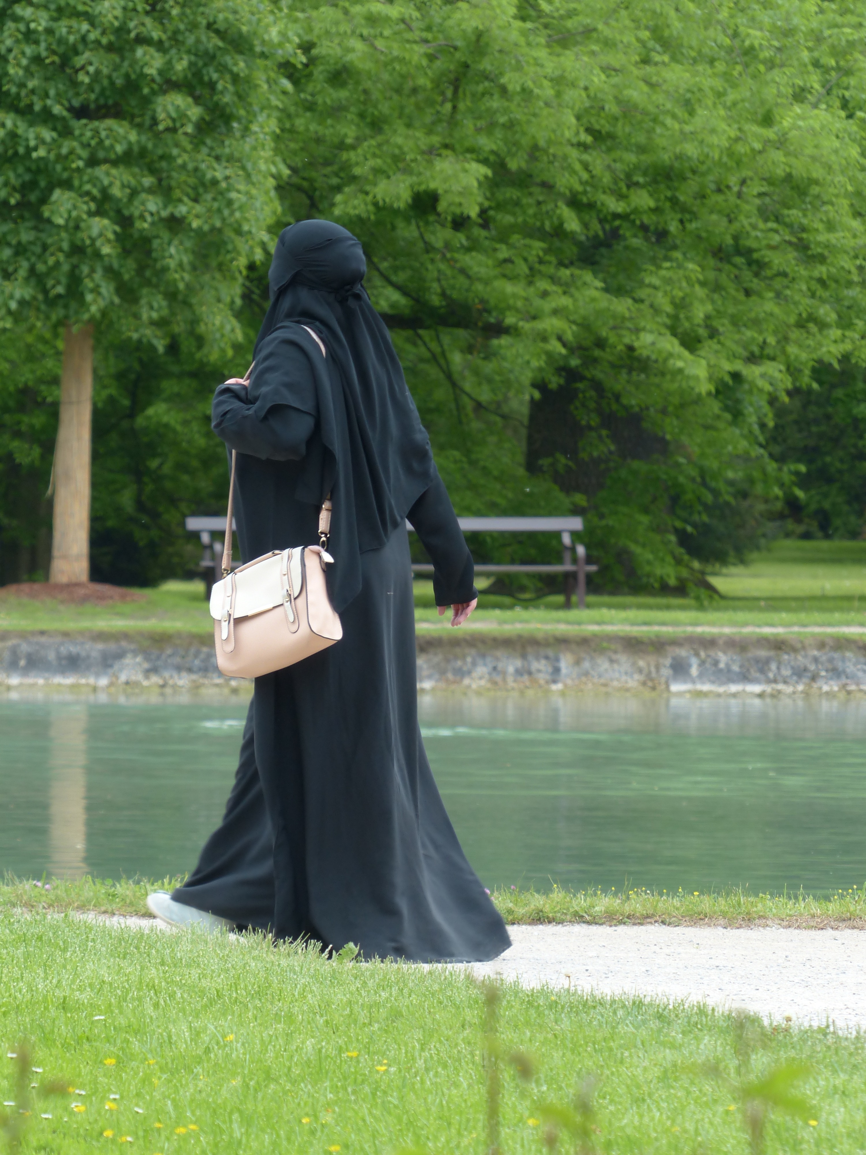 women's black hijab and abaya