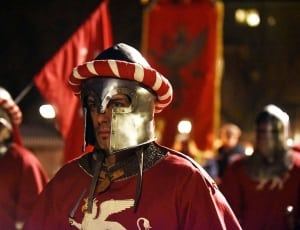man in red soldier suit and gray knight helm thumbnail