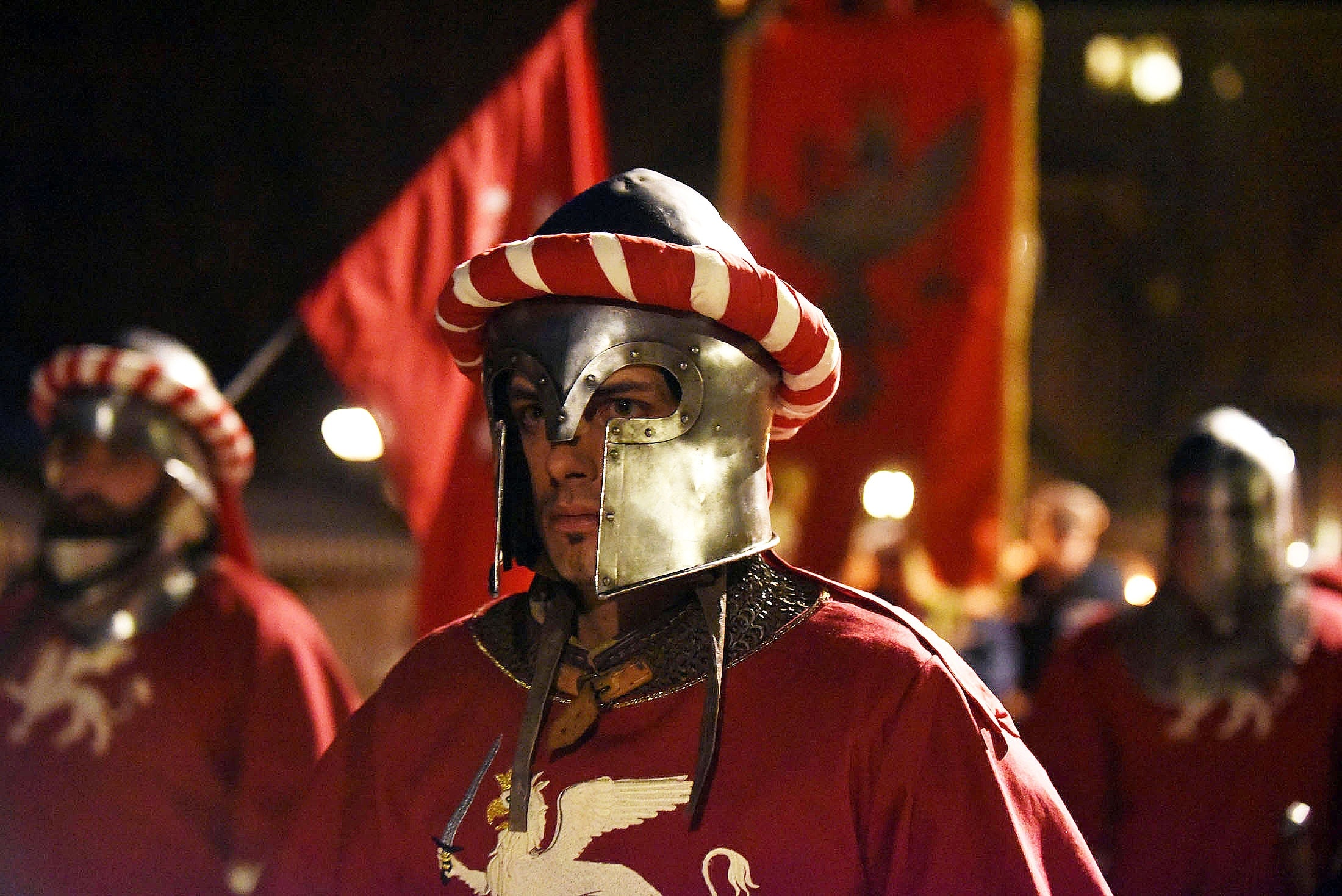 man in red soldier suit and gray knight helm