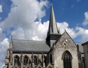 white and gray church under blue sky thumbnail