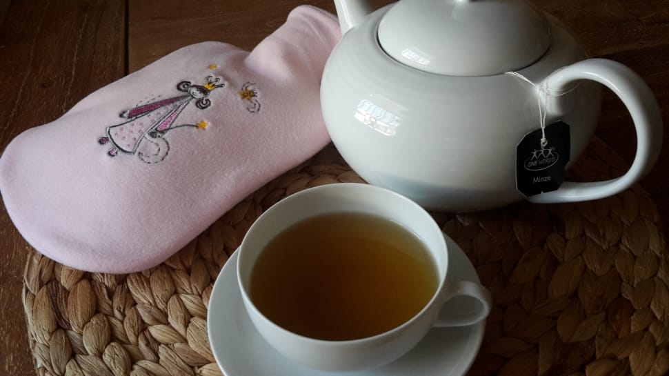 white ceramic teapot with mug and tea preview