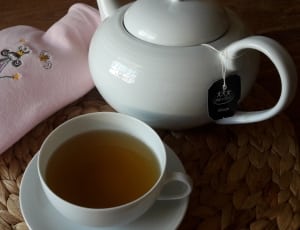 white ceramic teapot with mug and tea thumbnail