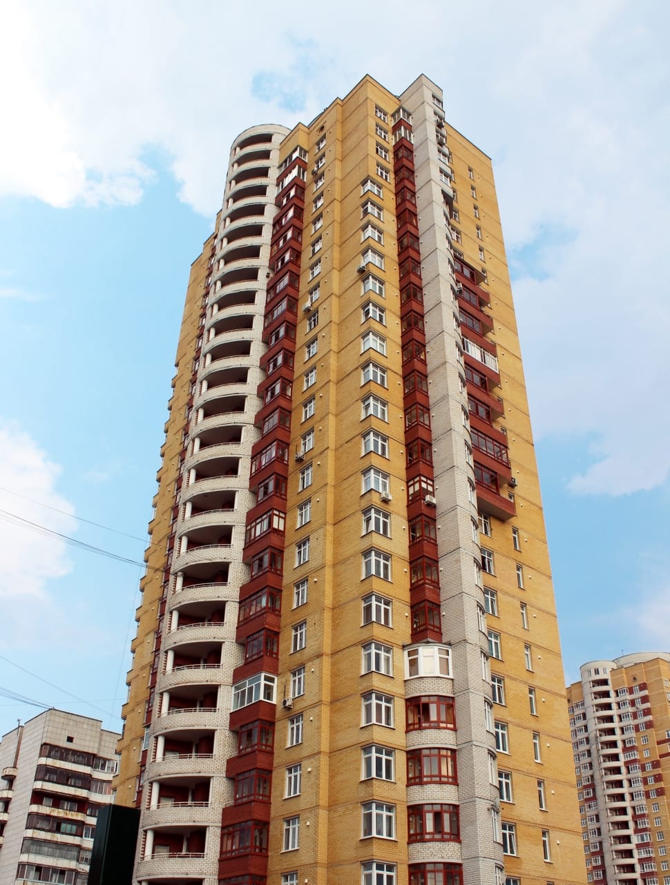 yellow red and beige concrete high rise building preview