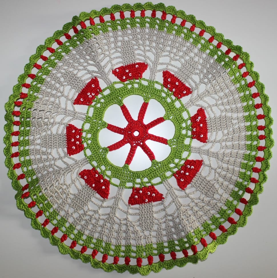 gray, red, and green knitted doily preview