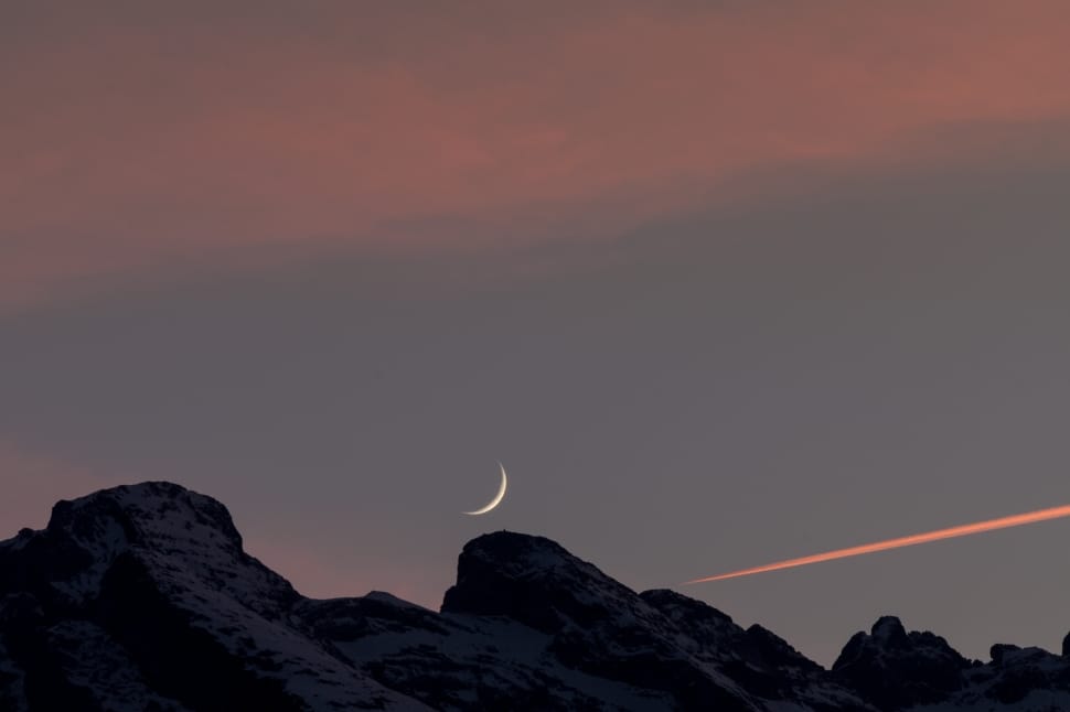 silhouette of mountain under crescent moon preview