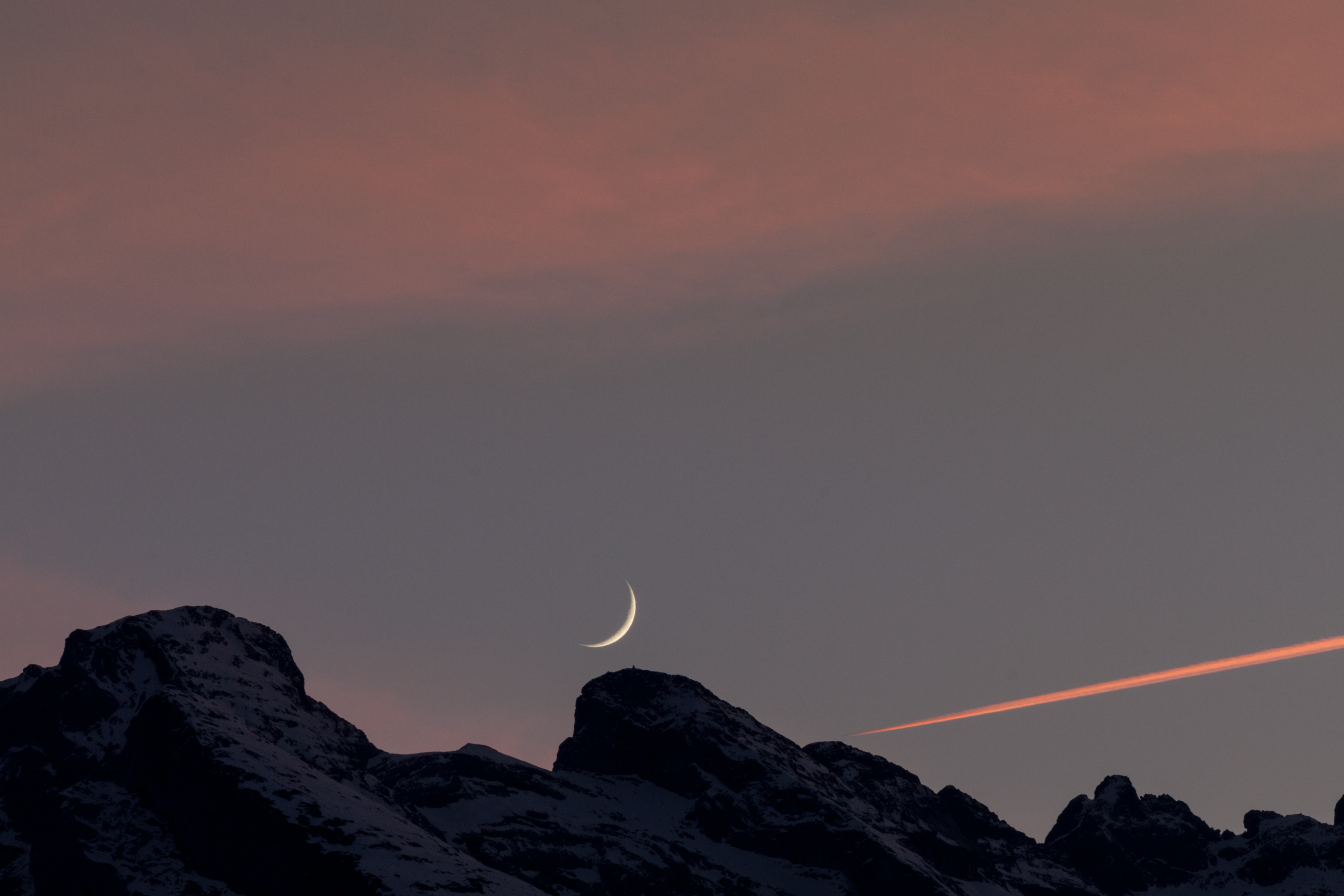 silhouette of mountain under crescent moon