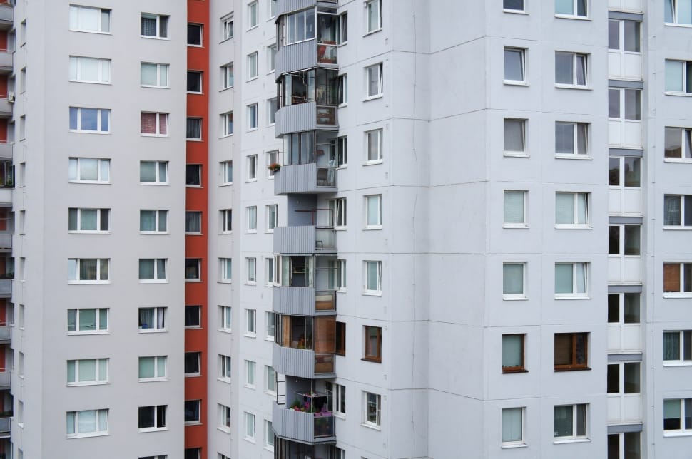 white gray and orange condominium building preview