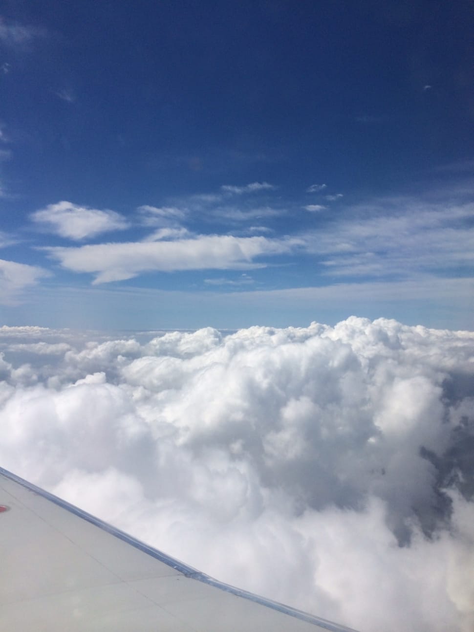 white cloudy sky photo taken via plane preview