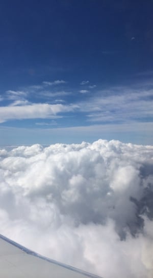 white cloudy sky photo taken via plane thumbnail