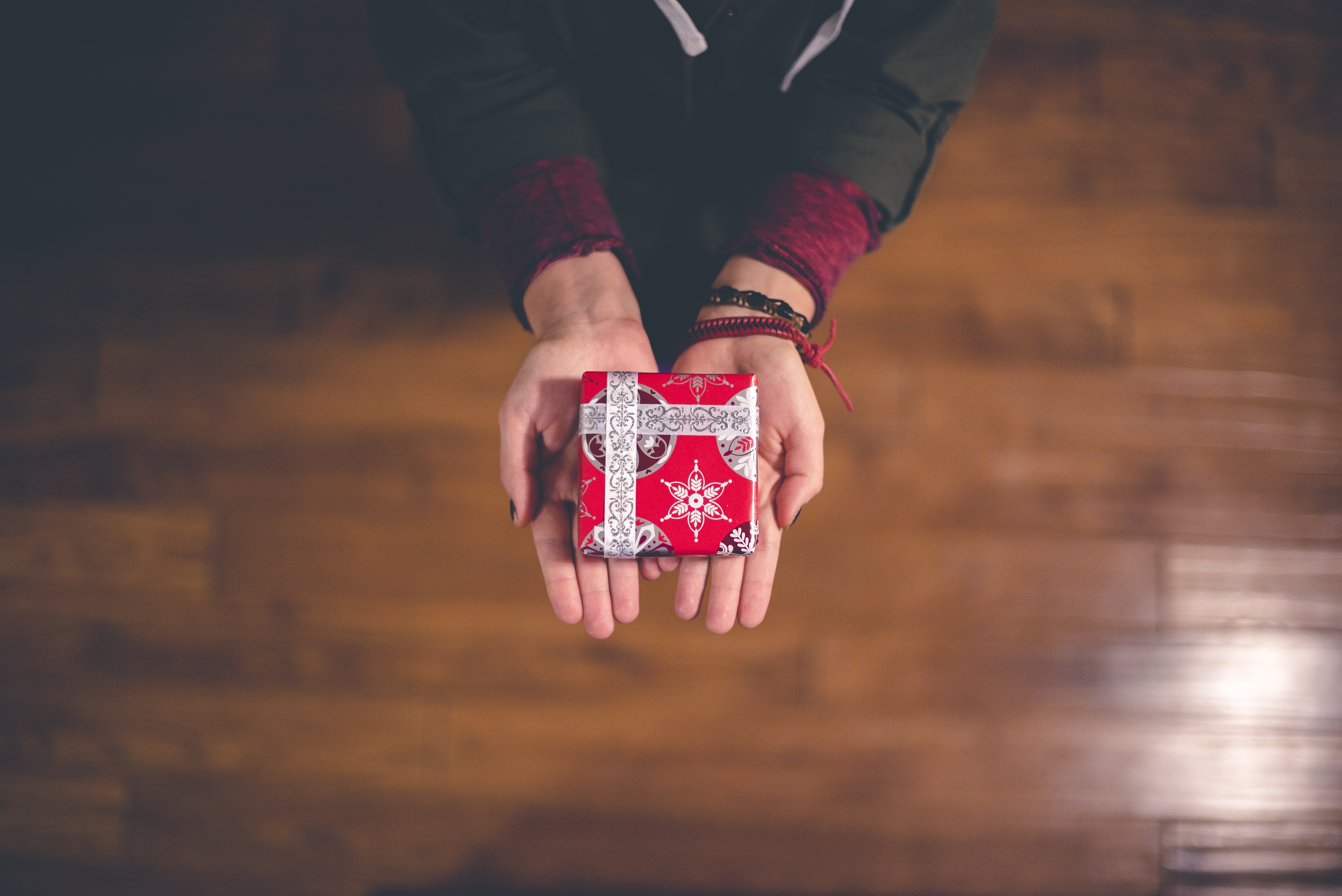 person holding small gift box