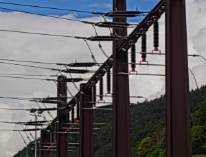 high tension electric post and wires thumbnail