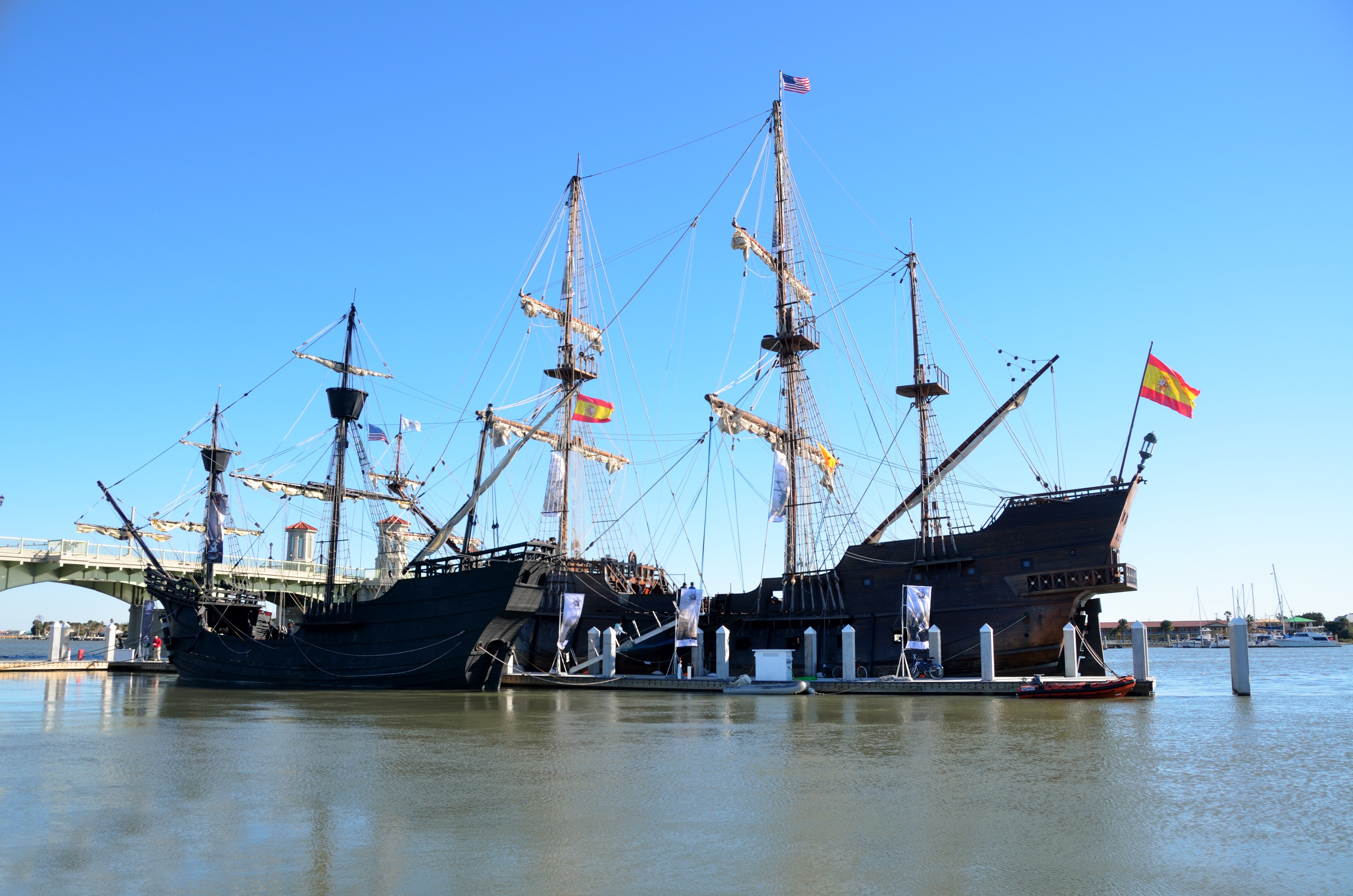 2 brown and black sail ships