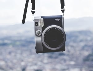 black and gray instax compact camera thumbnail