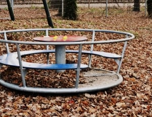 gray metal round table with fence on park thumbnail
