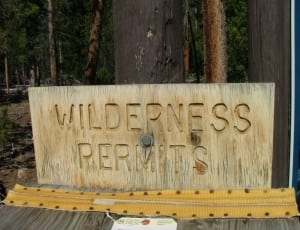 brown wooden wilderness permits signage thumbnail
