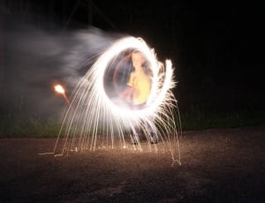 child playing with fireworks at night thumbnail