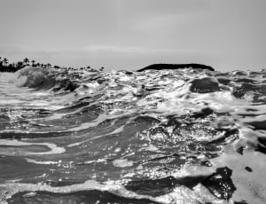 grayscale photo of body of water thumbnail