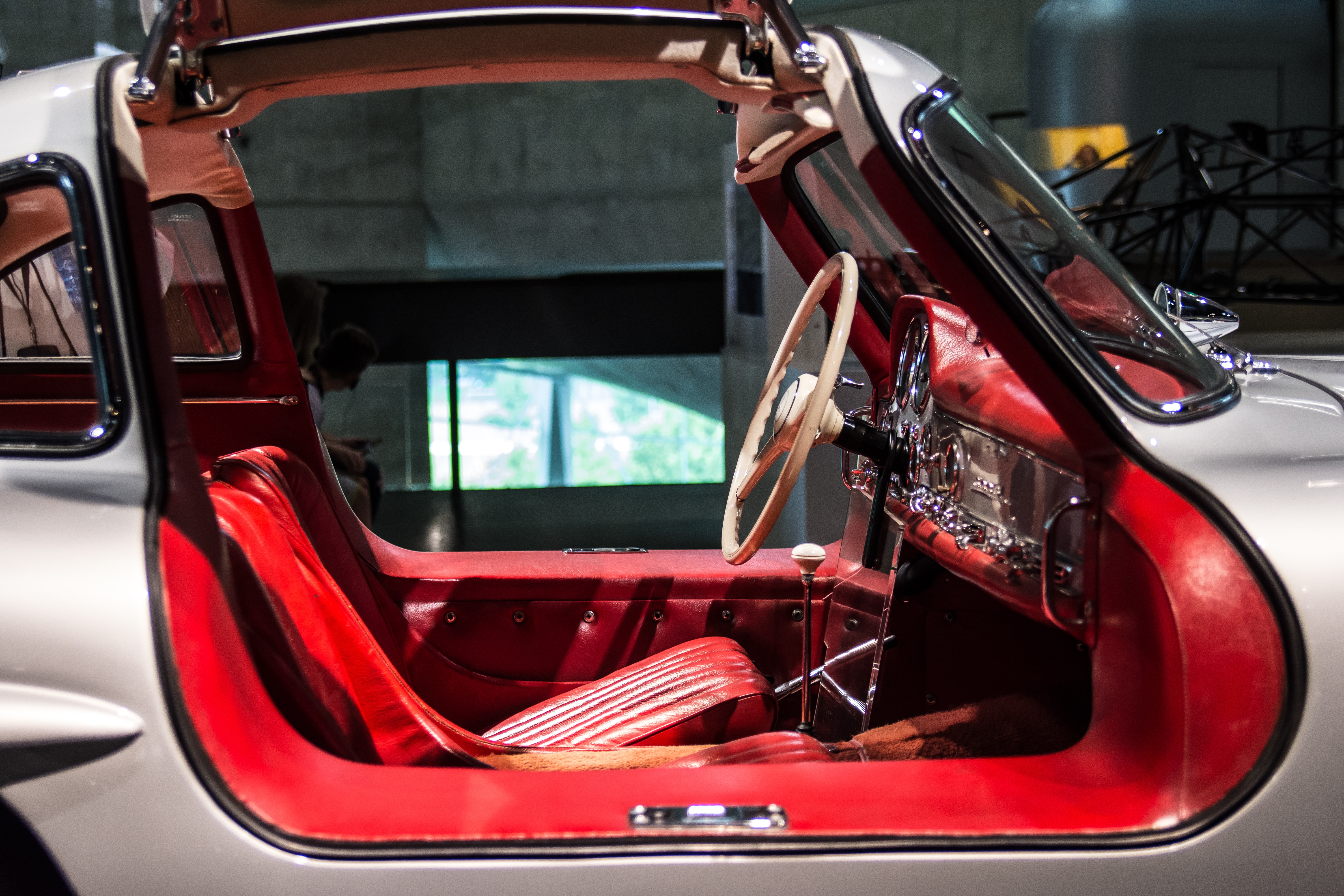 gray car with red and white auto interior