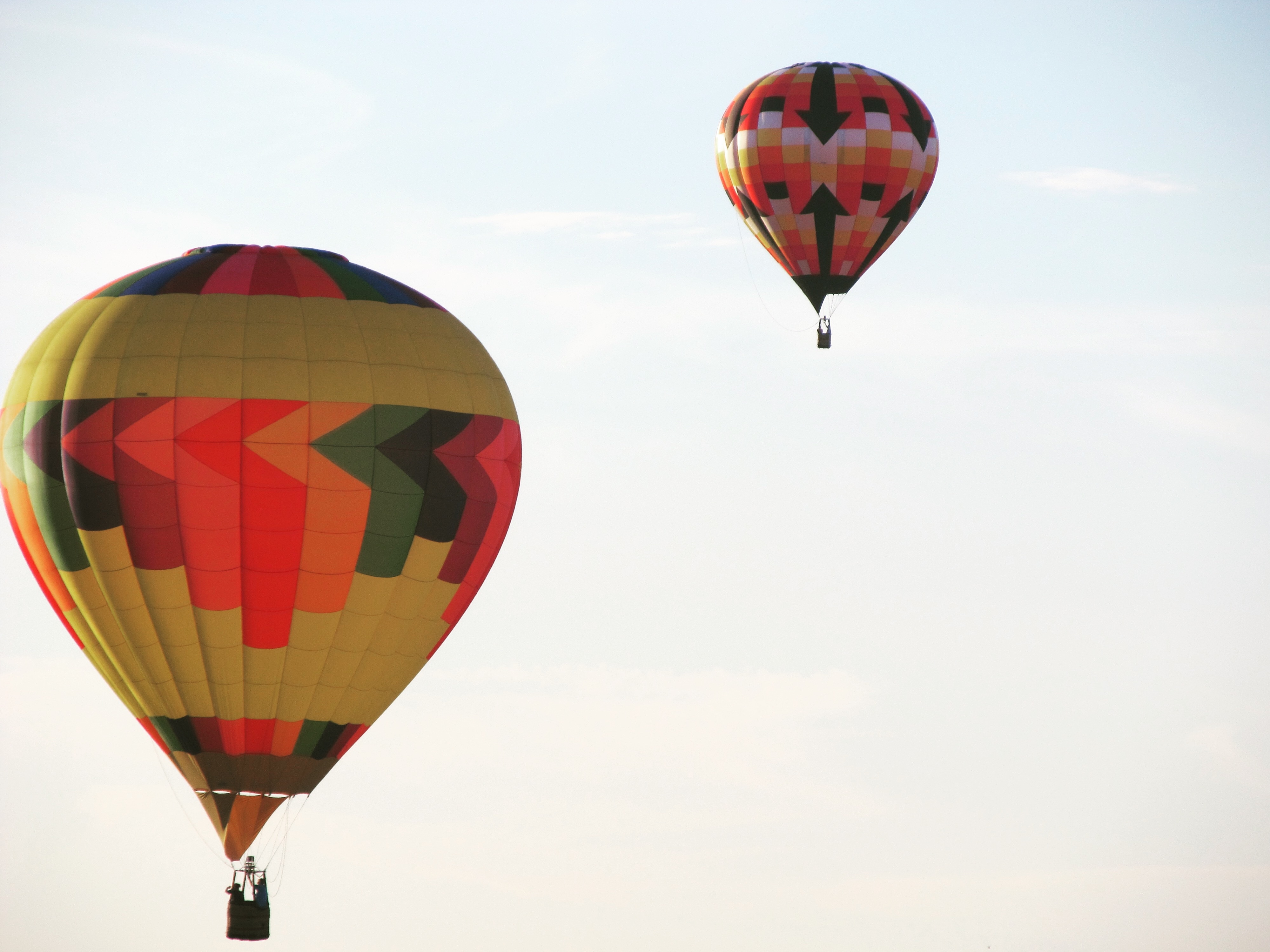2 multicolored hot air balloons