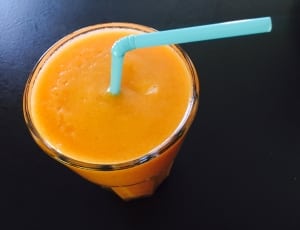 orange shake on clear drinking glass thumbnail