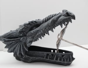 gray dragon head bust statue thumbnail