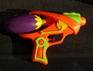 orange and purple plastic water gun thumbnail