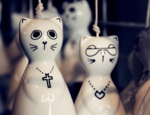 2 white ceramic cat figurines thumbnail