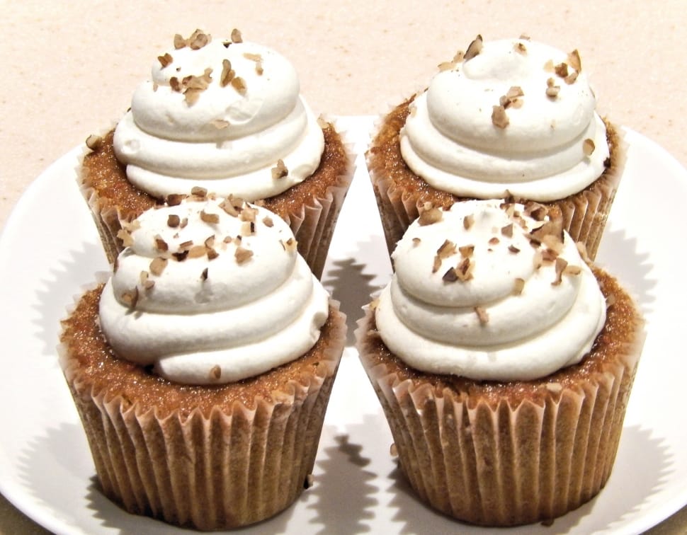 4 brown cupcakes with with creams preview