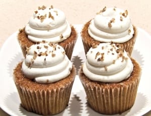 4 brown cupcakes with with creams thumbnail
