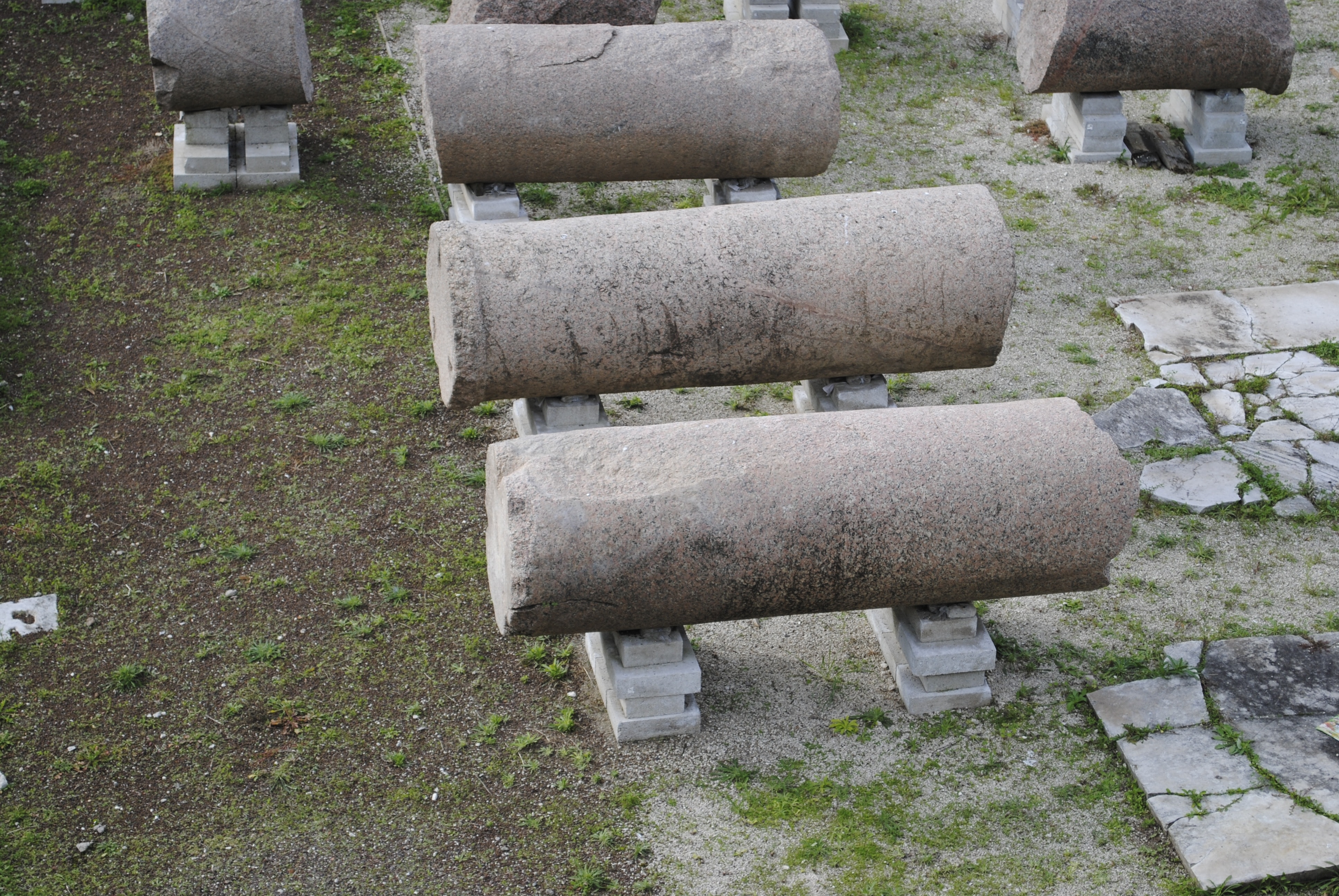 three cylindrical concrete on top of white concrete