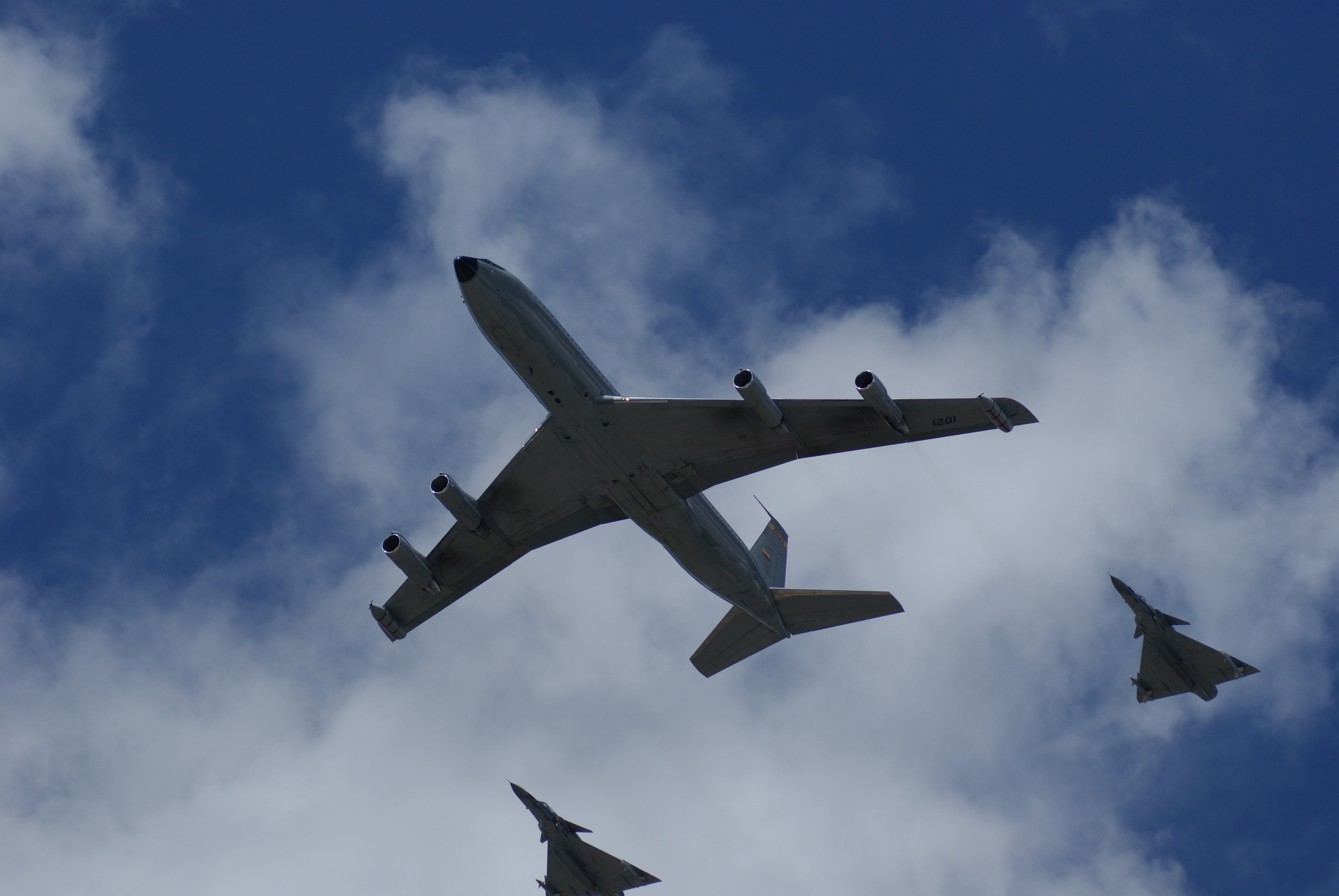three airplanes under blue sky