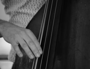 grayscale photo of person playing instrument thumbnail