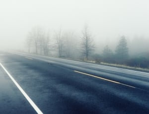 open asphalt road during foggy weather condition at daytime thumbnail