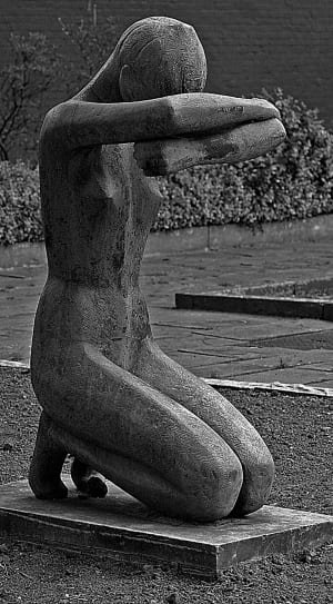 woman in with both arms covering her eyes kneeling concrete statuette thumbnail