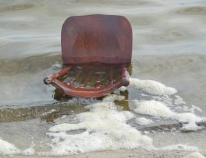 brown wooden chair on beach line thumbnail