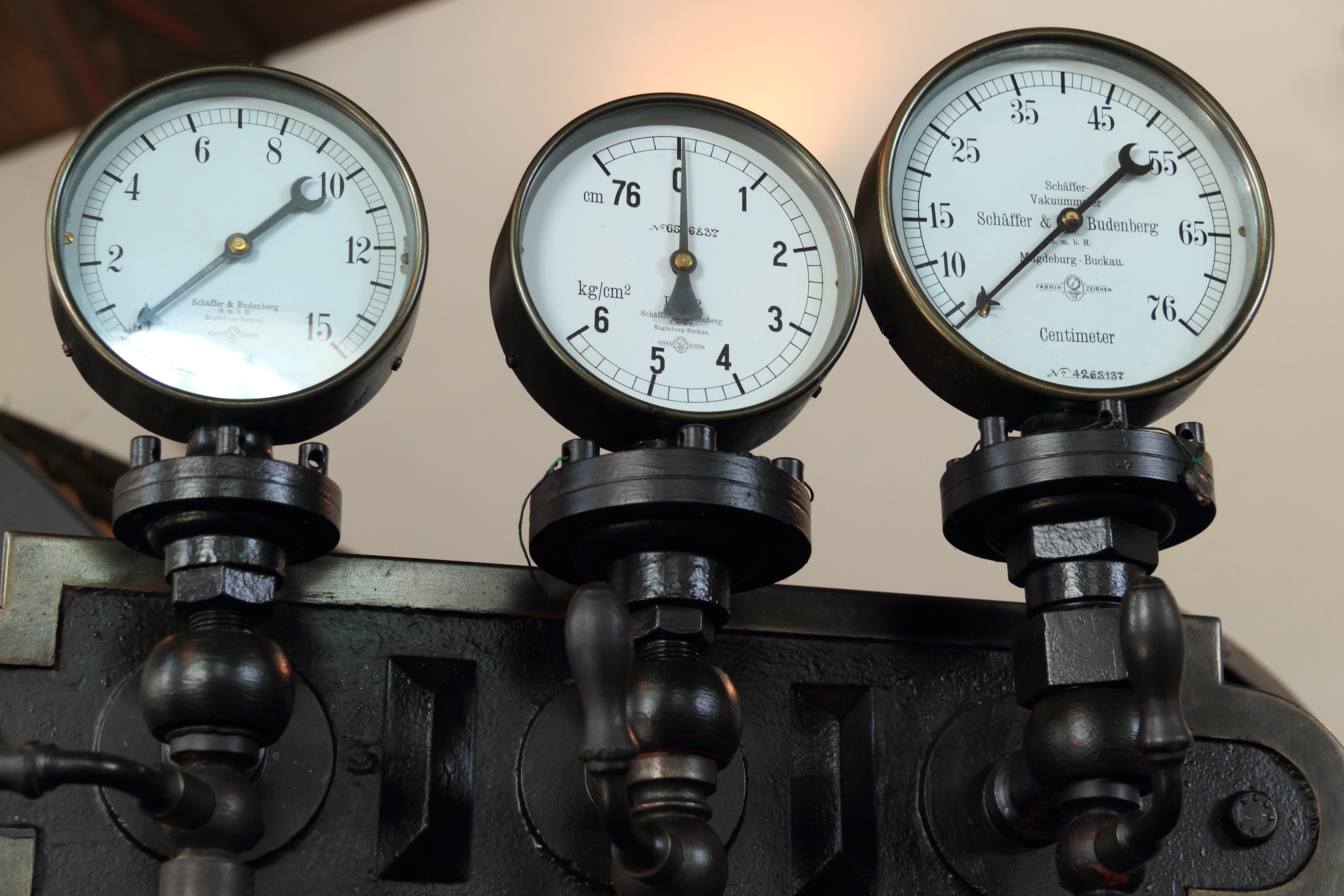 three black gauge meters
