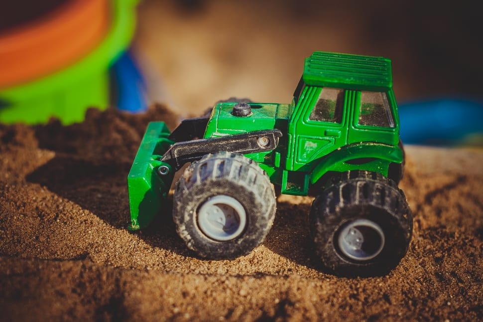 green and black front loader toy preview