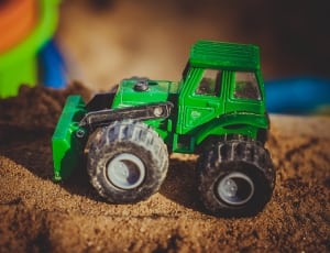 green and black front loader toy thumbnail
