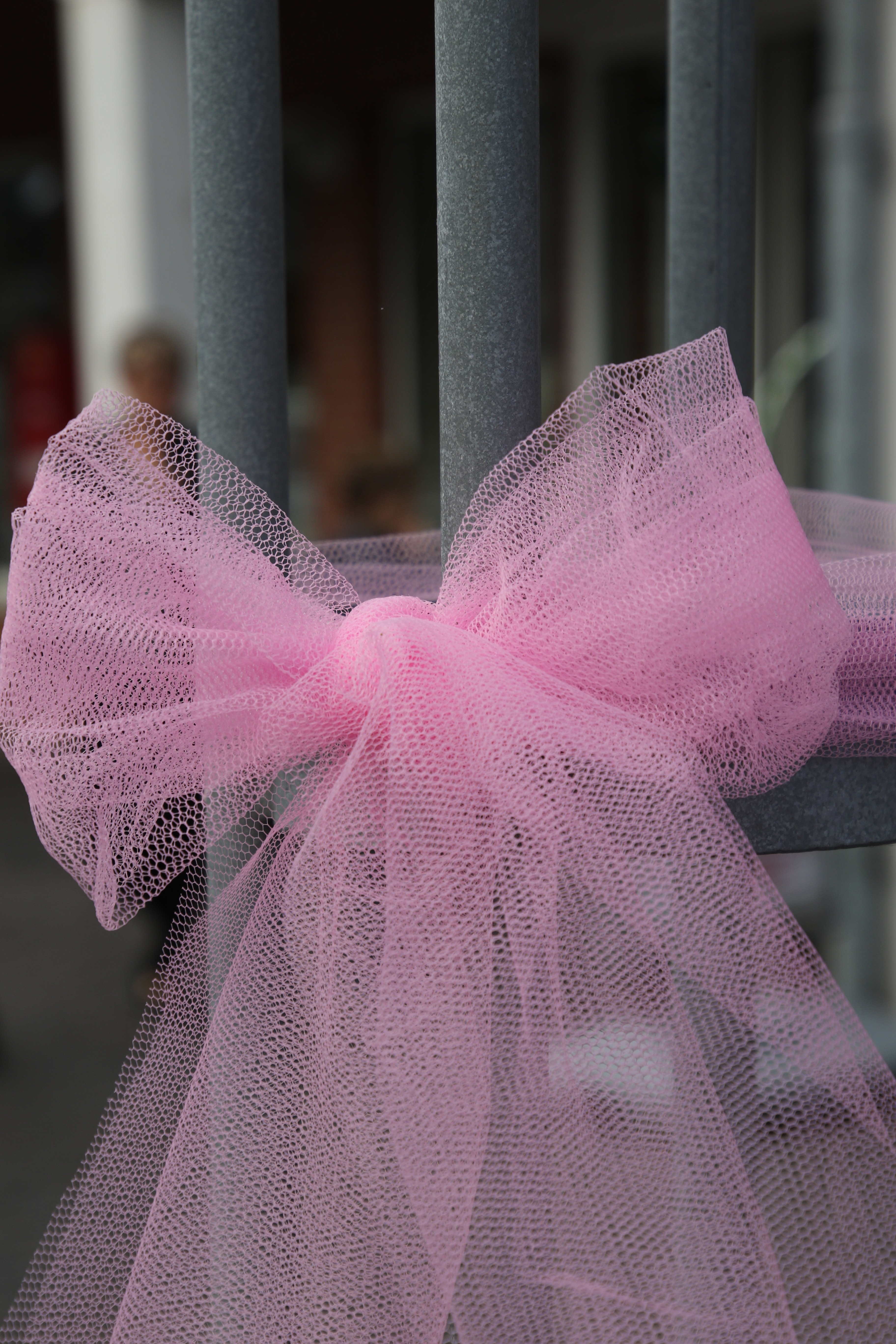 pink ribbon on grey metal