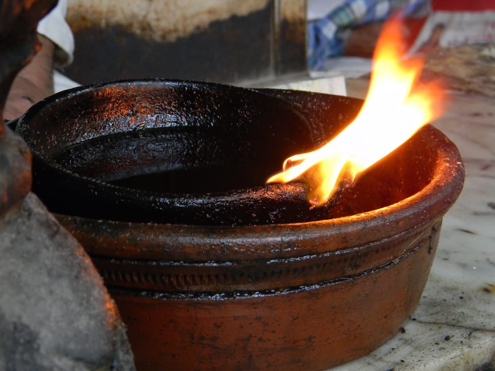 black and brown wooden bowl on fire preview