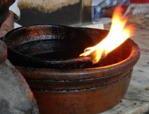 black and brown wooden bowl on fire thumbnail