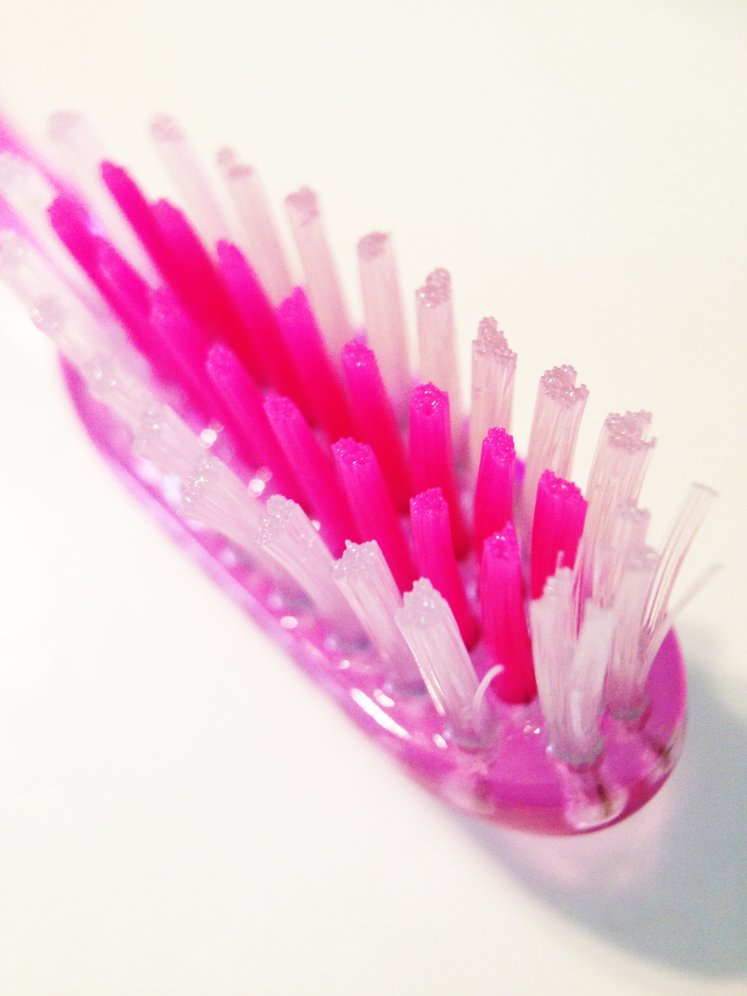 pink and white toothbrush