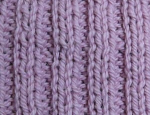 purple knitted textile thumbnail